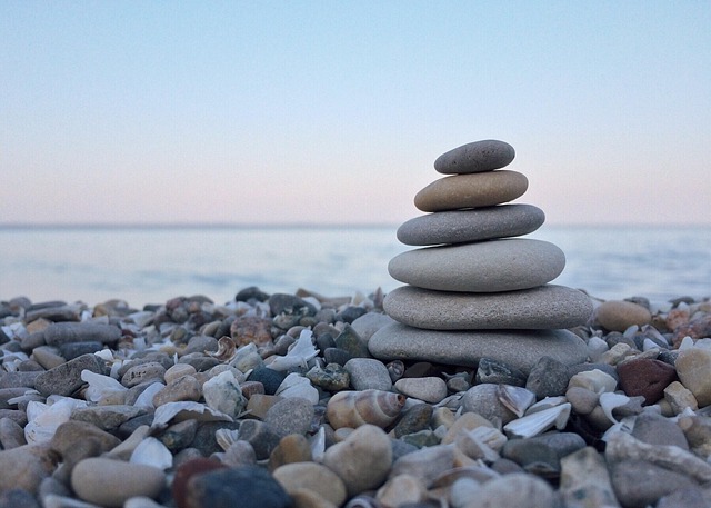 A stack of smooth rocks on the shore